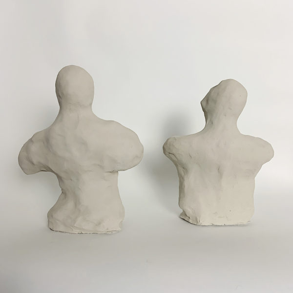 Sculptures of white clay busts signed Dainche, contemporary artist
