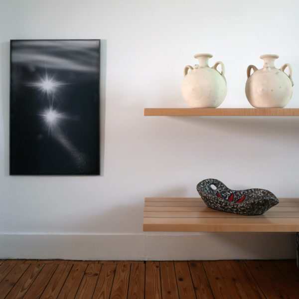 Artistic photo of reflections of light on water and constellations in black and white, by Laurent Laporte