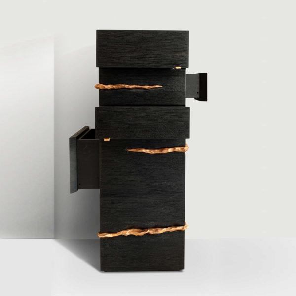 Column with drawers in solid oak stained with Indian ink and sculpted by Hoon Moreau
