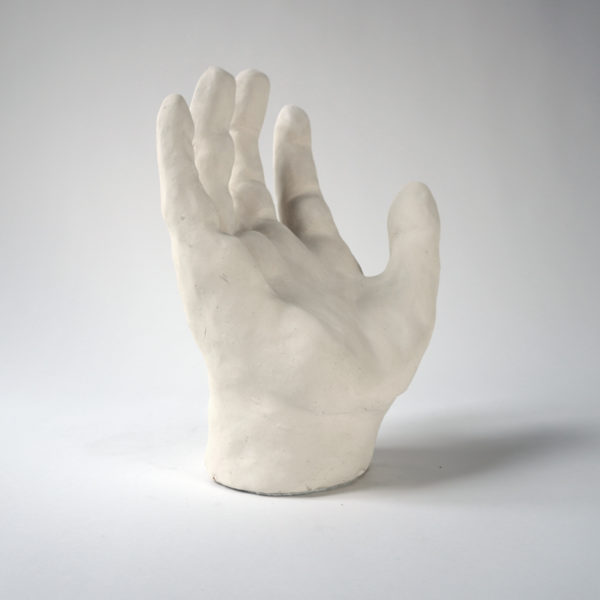 White clay hand sculpture by Dainche, contemporary artist