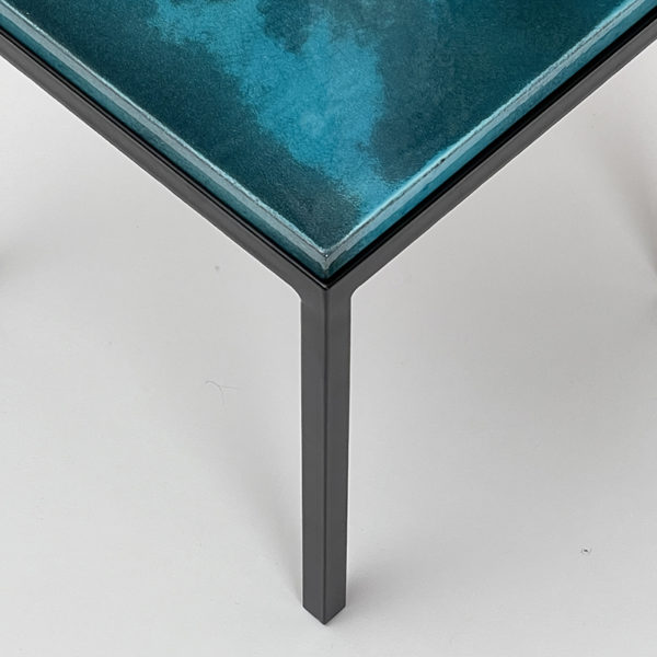 Square side table in black lacquered metal with blue top in glazed ceramic, by Gerard Simoën