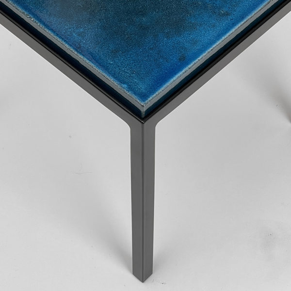 Square side table in black lacquered metal with blue top in glazed ceramic, by Gerard Simoën