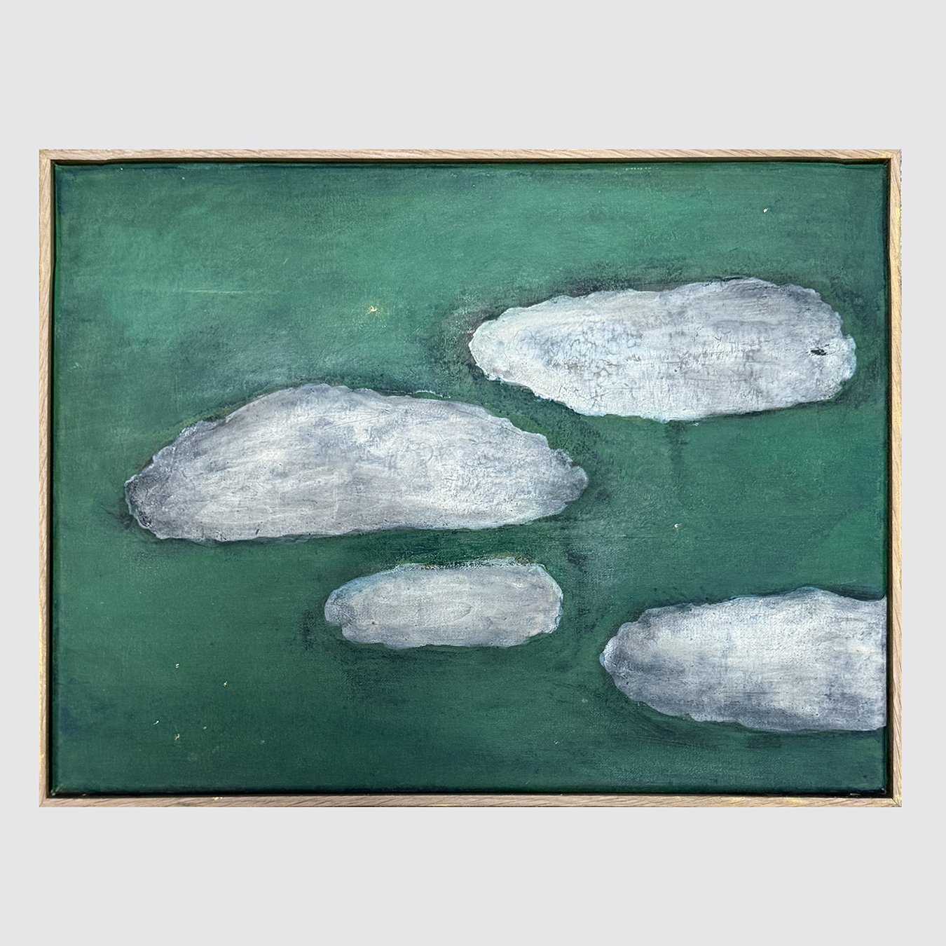 SMALL GREY CLOUDS ON GREEN BACKGROUND